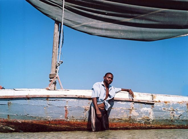 Asking permission and getting to know your subjects. This is Raphael posing next to his Dhow boat. “I tell them why I want to take their photo and where I hope to use it and why - and if they agree I take it, says Smith.  Photo:  Sydelle Willow Smith 